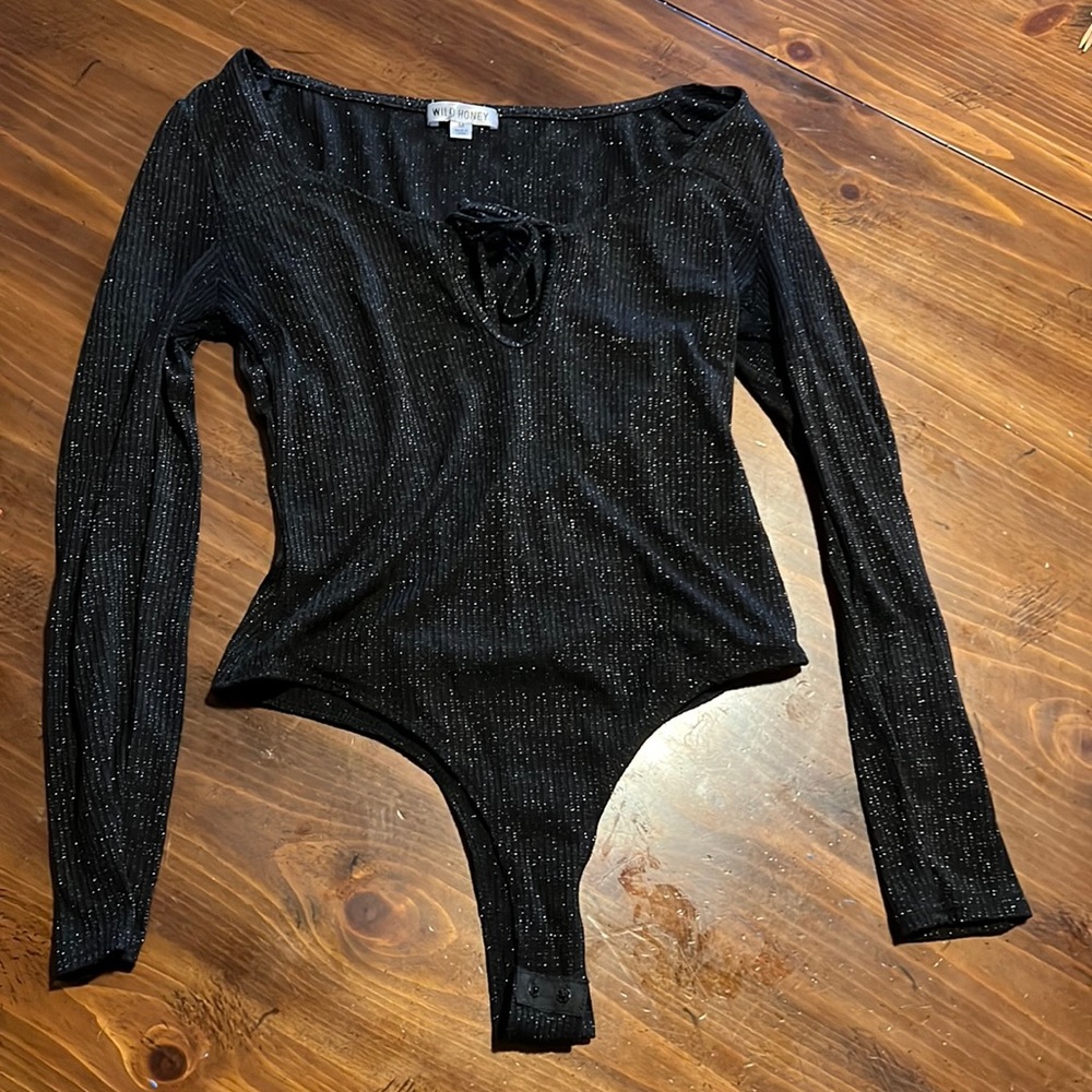Sparkly unitard shirt that snaps with tie front